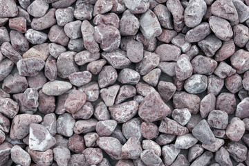 Background made of a closeup of a pile of pebbles.