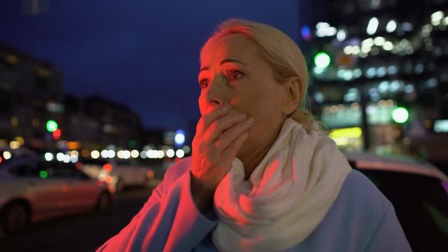 Frightened woman cant understand how she ended up in middle of noisy road