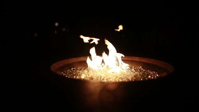 A fire burns at night in 120p super slow motion.
