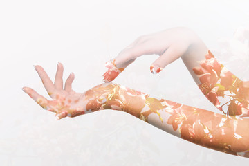 Double exposure effects on silhouette of two female hands