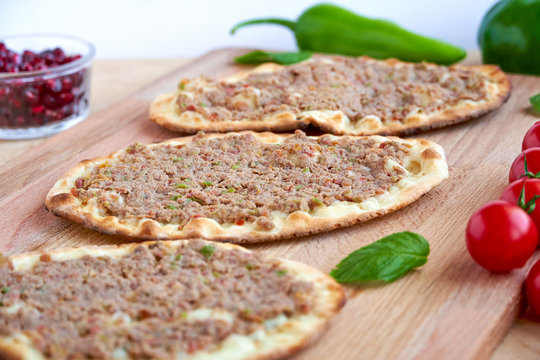 Meat with dough, manakeesh meat, arabic flat bread with meat. Close up