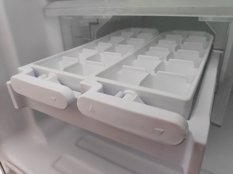 Ice maker container in the refrigerator.