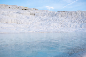 Pamukkale termal waters with the white rocks. Pamukkale meaning cotton castle is beautiful landscape in Denizli, Turkey.
