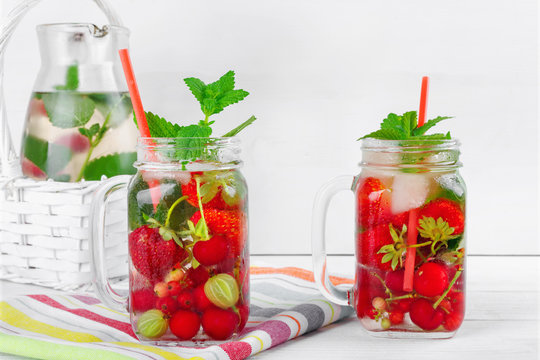 Two glasses with drink of fresh ripe berries on beautiful towel © Loraliu