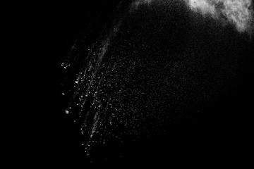White powder explosion clouds.Freeze motion of white dust particles on black background.