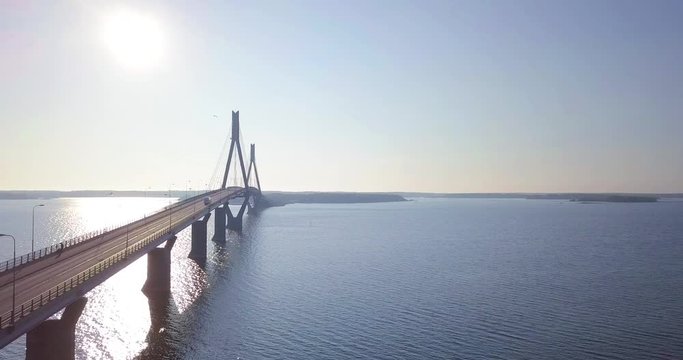 Aerial perspective of traffic going over long cable-stayed bridge in Vasa, Ostrobothnia, Finland