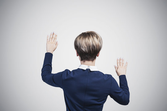 Rear view of woman working with touchscreen, gray - Powered by Adobe