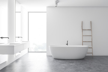 Modern white bathroom with tub and double sink