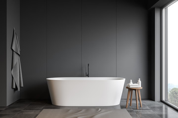 Fototapeta na wymiar Gray bathroom interior with bathtub
