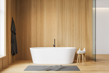 White and wooden bathroom with tub