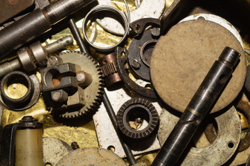 Pile of fasteners and screws close up. scrap metal. different metal details