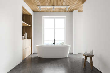 Fototapeta na wymiar Luxury white bathroom with tub and cabinet