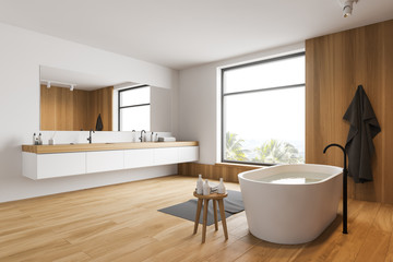 White and wooden bathroom corner, tub and sink