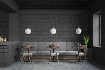 Gray restaurant interior with sofa