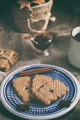speculoos Christmas cookies on a plate with the Bavarian flag with star anise, honey and cinnamon, the effect of the film and tinting, soft focus and bokeh