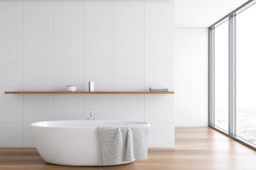 Panoramic white tile bathroom interior with tub