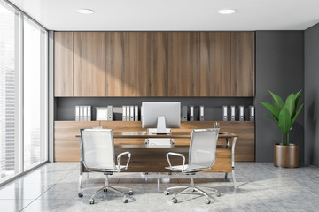 Stylish gray and wooden CEO office interior