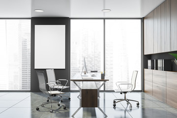 Fototapeta na wymiar Gray and wooden CEO office with poster