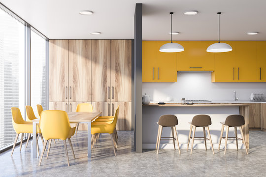 Yellow Kitchen With Bar And Table