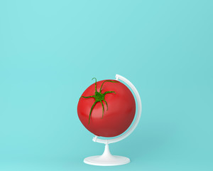 Globe sphere orb tomato concepts on pastel blue background. minimal idea food and fruit concept.