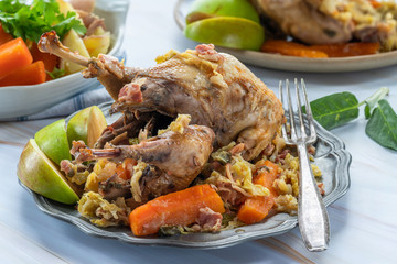 Pot-roast pheasant in cider with bacon and vegetables
