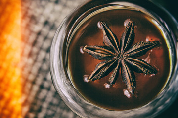 star anise lies on honey top view, red background