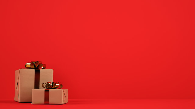 Isolated Christmas gift packages with golden ribbons on red background