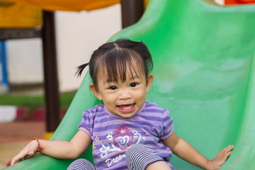 Portrait image of 1-2 yeas old baby. Happy Asian child girl smiling and laughing. She playing with...