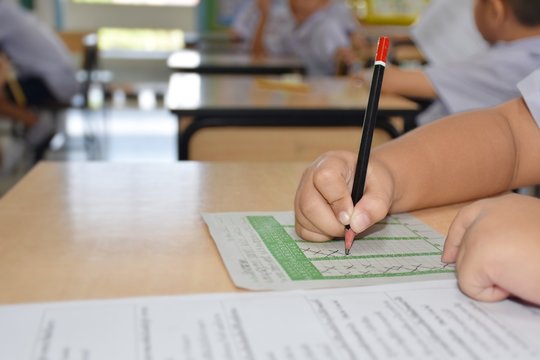 Thai Primary Students In Elementary School Are Taking The Final Exam With Intention And Seriousness In Classroom