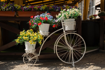 White bicycles with flowers.