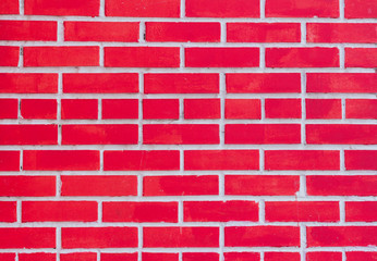 Red brick wall fragment, the texture of a brick wall painted red