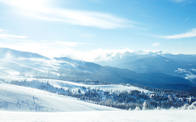 Fototapeta na wymiar Nature. Beautiful winter landscape with snow covered trees. Beautiful view of the mountains from a high point. Concept of travel, freedom, beauty of nature. Beautiful day, sunny weather, blue sky.