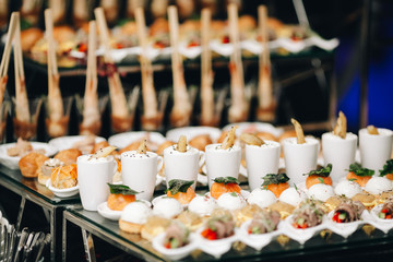 Closeup of buffet table served with exotic food