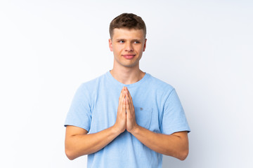 Young handsome man over isolated white background scheming something