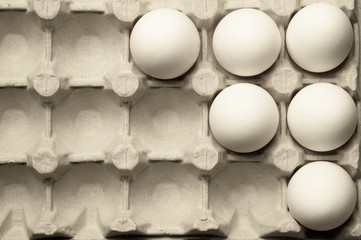 White eggs in carton box background. food ingredient. protein nutrition. healthy breakfast