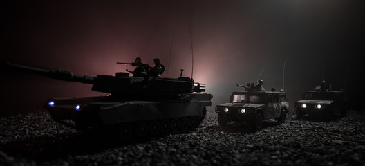 Military patrol car on sunset background. Army war concept. Silhouette of armored vehicle with soldiers ready to attack. Artwork decoration. Selective focus © zef art