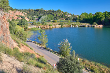 Fototapeta na wymiar Landscape view of the waterfalls of the Laguna La Lengua Lake in the Lagunas de Ruidera Lakes Natural Park, Albacete province, Castilla la Mancha, Spain