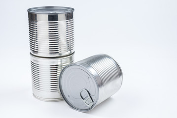 Group of silver canned food on white background.
