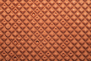 Chocolate bar macro texture. squared pattern background