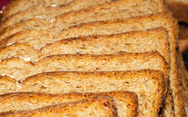Sliced bread in a row close up. baking background