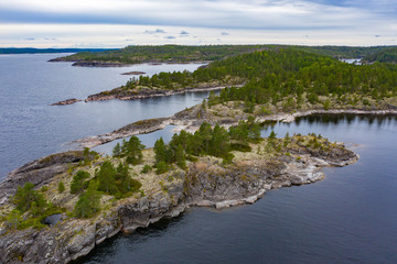 Karelia. Russia. Ladoga with a quadcopter. Russian taiga. Karelia aerial view. Islands in lake Ladoga. Coniferous forest. Taiga in the Republic of Karelia. Vacations in Russia. Russian Federation