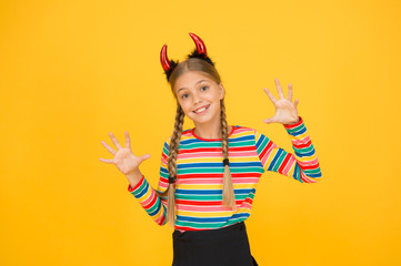 She devil. Halloween party girl yellow background. Little girl wear red devil horns headband....