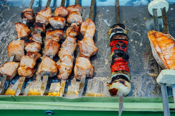 kebabs and vegetables cooked on fire grill