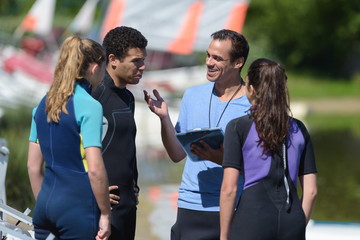 Obraz premium a team and stand up paddler training