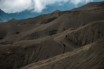 Fototapeta na wymiar Black sand dune in Mount Bromo Volcano in East Java Indonesia. Bromo Tengger Semeru National Park, East Java, Indonesia Layer Volcanic ash