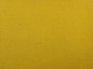 Cement wall texture in colorful.  Wall background.  Full frame shot of yellow wall background, painted wall background.