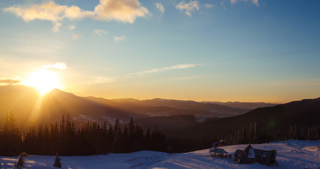 Sunrise in the mountains. Beautiful view of the mountains from a high point. Dawn in mountain...