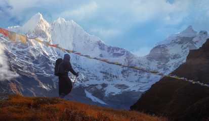 Active hiker hiking, enjoying the view  at Himalaya mountains and Mount Ama Dablam landscape....