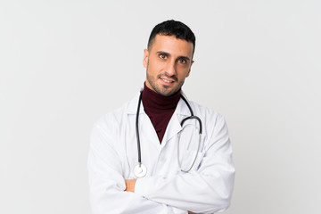 Fototapeta premium Young man over isolated white background with doctor gown