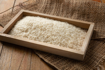 Jasmine rice seeds placed on a wood